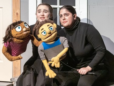 Hannah Noll (L) performs as Kate Monster and Kamilah Khan (R) performs as Princeton, during Ashbury College's Cappies production of Avenue Q, on December 12, 2019 in Ottawa, On.