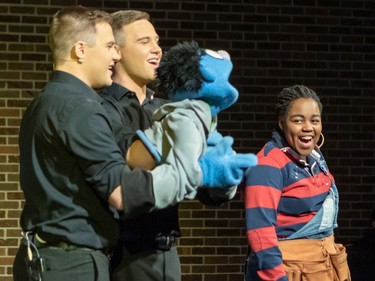 Brendan O'Neill (L) and Aidan O'Neill (C) perform as Nicky and Ozioma Molokwu (R) performs as Gary Coleman, during Ashbury College's Cappies production of Avenue Q, on December 12, 2019.