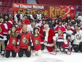 Ottawa Senators owner Eugene Melnyk (front left) hosted over 100 children at the 16th annual Eugene Melnyk Skate for Kids at Canadian Tire Centre on Friday, Dec. 20.