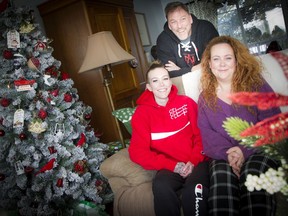 Shannon McDonald, Paul McDonald, and their daughter 19-year-old Julia McDonald at their home in Munster Sunday December 22, 2019.