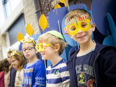 Isaac Lew, right, was among the children who sang during Sunday's Peace Menorah event in Barrhaven.