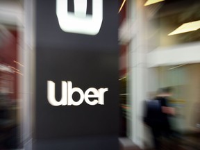 In this file photo taken on May 8, 2019 an Uber logo is seen outside the company's headquarters in San Francisco, California.