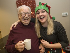 René Dostaler, 97, shares a lighter moment with activities manager Shelby McLean in the lounge of the Maplewood Retirement Home.