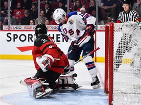 Colin White of the U.S. slips the puck past Canadian netminder Carter Hart for a goal in the 2017 gold-medal game at Montreal.