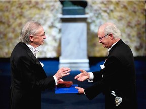 Austrian author and co-laureate of the 2019 Nobel Prize in Literature Peter Handke receives his Nobel from King Carl XVI Gustaf of Sweden (R) during the award ceremony on December 10, 2019 at the Concert Hall in Stockholm, Sweden.