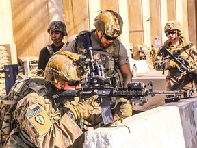 A handout picture received from the U.S. Embassy in Iraq on Dec. 31, 2019, shows American soldiers taking position around the embassy in the capital Baghdad.