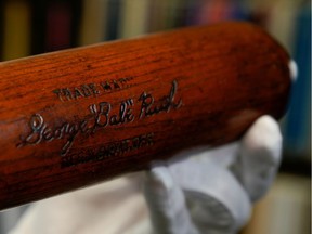 FILE PHOTO: Babe Ruth's 500th home run bat is held by SCP Auctions president David Kohler before it goes up for auction in Laguna Niguel, California, U.S., November 25, 2019.