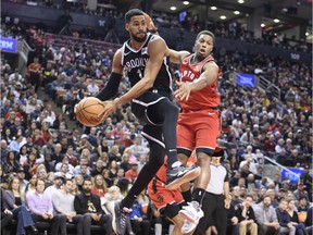 Brooklyn Nets guard Garrett Temple drives to the basket as Toronto Raptors guard Kyle Lowry (7) tries to defend during the fourth quarter at Scotiabank Arena.