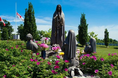 8. PORTUGUESE COMMUNITY:
Canada is home to nearly half a million people of Portuguese descent, about 10,000 of whom live in the Ottawa area. In 1997, Beechwood Cemetery celebrated this vibrant diaspora by setting aside a special section for the exclusive use of the Portuguese community. The central feature is a beautiful statue of Our Lady of Fatima, surrounded by the kneeling figures of the three shepherd children who, in 1917, reported seeing a vision of an angel — a woman said to be the Virgin Mary — who spoke to them of peace, prayer and devotion.