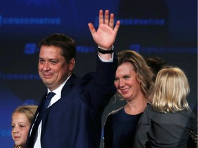 Conservative leader Andrew Scheer waves with wife Jill and children as he addresses supporters after losing to Justin Trudeau in the federal election Oct. 21.