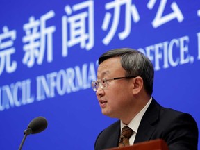 Chinese Vice Commerce Minister and Deputy International Trade Representative Wang Shouwen speaks during a news conference on the state of trade negotiations with U.S. in Beijing on Friday.