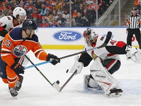 Ottawa Senators goaltender Craig Anderson makes a save on Edmonton Oilers forward Riley Sheahan during the first period at Rogers Place on Dec. 4, 2019.