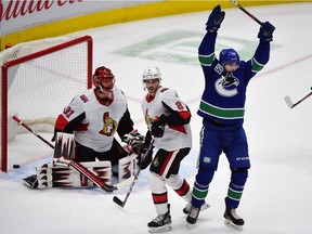 Canucks forward Zach MacEwan celebrates his goal against Senators goaltender Anders Nilsson during the first period of Tuesday's game in Vancouver.