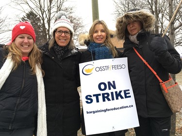 Educational support staff from Sawmill Creek PS, including Martha Adema, second from left, and Denise Natyshak, second from right, on the picket line at Ridgemont High School Wednesday morning.
Jacquie Miller, Postmedia