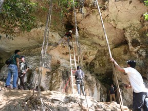 A team of archaeologists and researchers from Indonesia's National Research Centre for Archaeology and Griffith University, work in Leang Bulu' Sipong 4 limestone cave in South Sulawesi, Indonesia December 4, 2019.