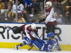 The Toronto Maple Leafs' Pierre Engvall is checked during the third period by the Colorado Avalanche's Nazem Kadri at the Scotiabank Arena in Toronto on Wednesday, Dec. 4, 2019. Ernest Doroszuk/Toronto Sun/Postmedia