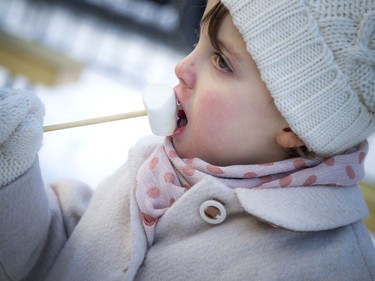 Four-year-old Anastasia Kamphuis enjoys a roasted marshmallow.