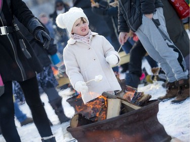 Four-year-old Anastasia Kamphuis roasted a marshmallow at the Mayor's 19th Annual Christmas Celebration that was held at City Hall, Saturday, December 7, 2019.   Ashley Fraser/Postmedia