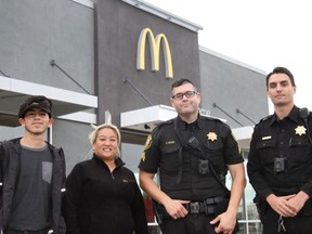 San Joaquin County Sheriff's Office deputies and staff from a Lodi, Calif., McDonald's are pictured in a photo posted on the police's Facebook post. (San Joaquin County Sheriff's Office/Facebook)