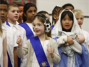Members of the St. Marguerite d'Youville School choir perform their school Christmas concert in Ottawa Wednesday Dec 18, 2019. The Grade 2-3 choir won top prize in a national contest for school choirs.