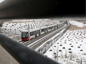 LRT travela through ice and snow in Ottawa Monday Dec 30, 2019.