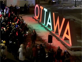 People gathered and celebrated the debut of the new OTTAWA letters on Friday, Dec. 20, 2019.   Tony Caldwell