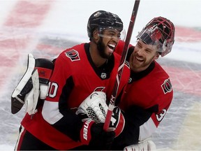 Ottawa Senator Anthony Duclair celebrates with goalie Anders Nilsson after scoring in overtime against the Columbus Blue Jackets at the Canadian Tire Centre on Saturday.