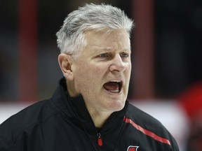 A file photo shows Marc Crawford during his stint as interim head coach of the Senators late in the 2018-19 NHL season.