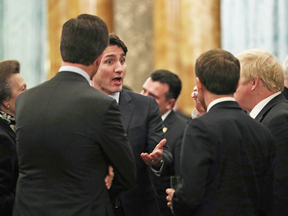 Prime Minister Justin Trudeau chats with British Prime Minister Boris Johnson and Princess Anne during a reception at Buckingham Palace on Tuesday. In footage of the conversation, he appears to be mocking U.S. President Donald Trump.