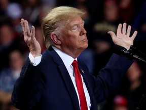 U.S. President Donald Trump reacts during a campaign rally in Battle Creek, Mich., on Wednesday, Dec. 18, 2019. REUTERS/Leah Millis ORG XMIT: SIN326