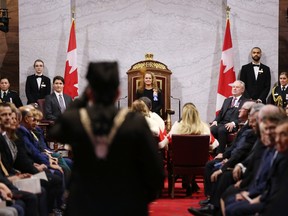 Canada's Governor General Julie Payette (C) and Prime Minister Justin Trudeau (L) wait for the start of The Throne Speech at the Senate of Canada on December 5, 2019 in Ottawa.