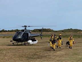 New Zealand Police Search and Rescue and Disaster Victim Identification staff return to Whakatane Airport after conducting a search for bodies in the aftermath of the eruption of White Island volcano, which is also known by its Maori name Whakaari, Sunday, Dec. 15, 2019.