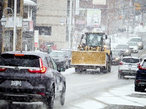Vehicles make their way through the snow along Somerset Street  Saturday.