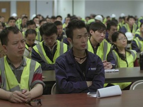 Chinese workers at Fuyao Glass America in American culture training. From the film AMERICAN FACTORY
