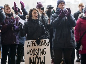 Activists take part in a rally for affordable housing outside Ottawa City Hall in February, 2019.