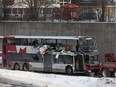 The OC Transpo bus involved in the crash at Westboro Station was towed from the scene, revealing extensive damage, on Jan. 12, 2019.