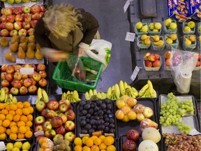 A woman shopping for fresh fruit and vegetables on December 9, 2015.