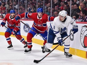 Mike Reilly, then with the Canadiens, tracks Zach Hyman of the Maple Leafs during a game last February.