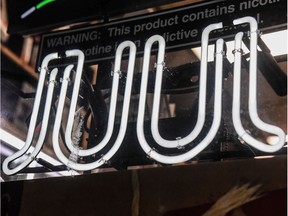 A sign advertising JUUL products in a file photo from December.