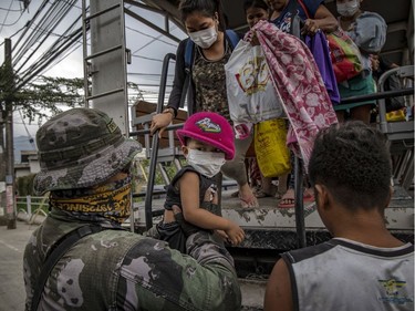 Residents fleeing Taal Volcano's eruption arrives at an evacuation center on January 13, 2020 in Santo Tomas, Batangas province, Philippines. The Philippine Institute of of Volcanology and Seismology raised the alert level to four out of five, warning that a hazardous eruption could take place anytime, as Manila's international airport suspended flights and authorities began evacuating tens of thousands of people from the area.