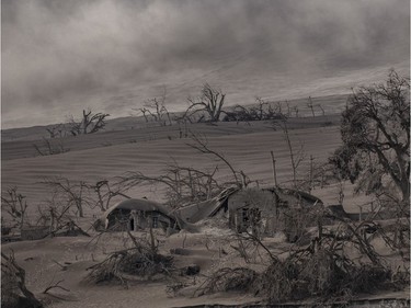 Houses near Taal Volcano's crater are seen buried in volcanic ash from the volcano's eruption on January 14, 2020 in Taal Volcano Island, Batangas province, Philippines. The Philippine Institute of of Volcanology and Seismology raised the alert level to four out of five, warning that a hazardous eruption could take place anytime, as authorities have evacuated tens of thousands of people from the area. An estimated $10 million worth of crops and livestock have been damaged by the on-going eruption, according to the country's agriculture department.