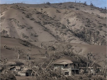 Buildings and houses near Taal Volcano's crater are seen covered in volcanic ash from the volcano's eruption on January 14, 2020 in Taal Volcano Island, Batangas province, Philippines. The Philippine Institute of of Volcanology and Seismology raised the alert level to four out of five, warning that a hazardous eruption could take place anytime, as authorities have evacuated tens of thousands of people from the area. An estimated $10 million worth of crops and livestock have been damaged by the on-going eruption, according to the country's agriculture department.