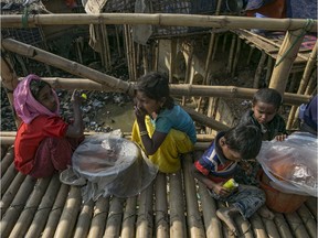 COX'S BAZAR, BANGLADESH - JANUARY 23: Young people sell goods on a bridge in a Rohingya refugee camp on January 23, 2020 in Cox's Bazar, Bangladesh.