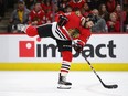 Zack Smith of the Chicago Blackhawks fires a shot against the Calgary Flames but was called for a high stick on the advance at the United Center on January 07, 2020 in Chicago, Illinois.