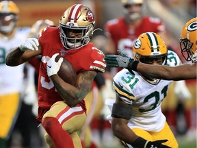 Raheem Mostert #31 of the San Francisco 49ers runs for a touchdown in the second quarter against the Green Bay Packers during the NFC Championship game at Levi's Stadium on January 19, 2020 in Santa Clara, California.