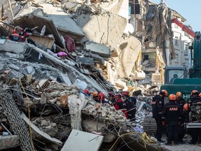 ELAZIG, TURKEY - JANUARY 26: Rescue workers work at the scene of a collapsed building  on January 26, 2020 in Elazig, Turkey.  (Photo by Burak Kara/Getty Images)