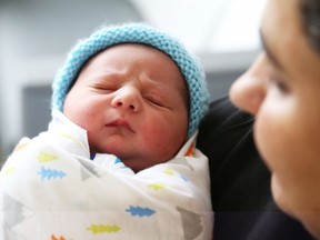 Vasu Anand holds her newborn baby who arrived exactly at midnight, Jan. 1, 2020 at the General campus of The Ottawa Hospital.
