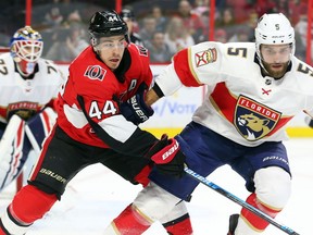 Jean-Gabriel Pageau of the Senators tries to work his way around Aaron Ekblad of the Panthers during the first period of Thursday's game at Canadian Tire Centre.