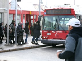 Passengers wait for the bus at the St.Laurent Station due to a broken down LRT.