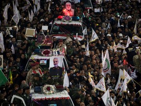 Mourners attend the funeral procession of the Iranian Major-General Qassem Soleimani, head of the elite Quds Force of the Revolutionary Guards, and the Iraqi militia commander Abu Mahdi al-Muhandis, who were killed in an air strike at Baghdad airport, in Kerbala, Iraq, Jan. 4, 2020. REUTERS/Abdullah Dhiaa al-Deen